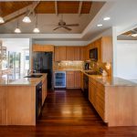 brown wooden kitchen cabinet with white kitchen counter top