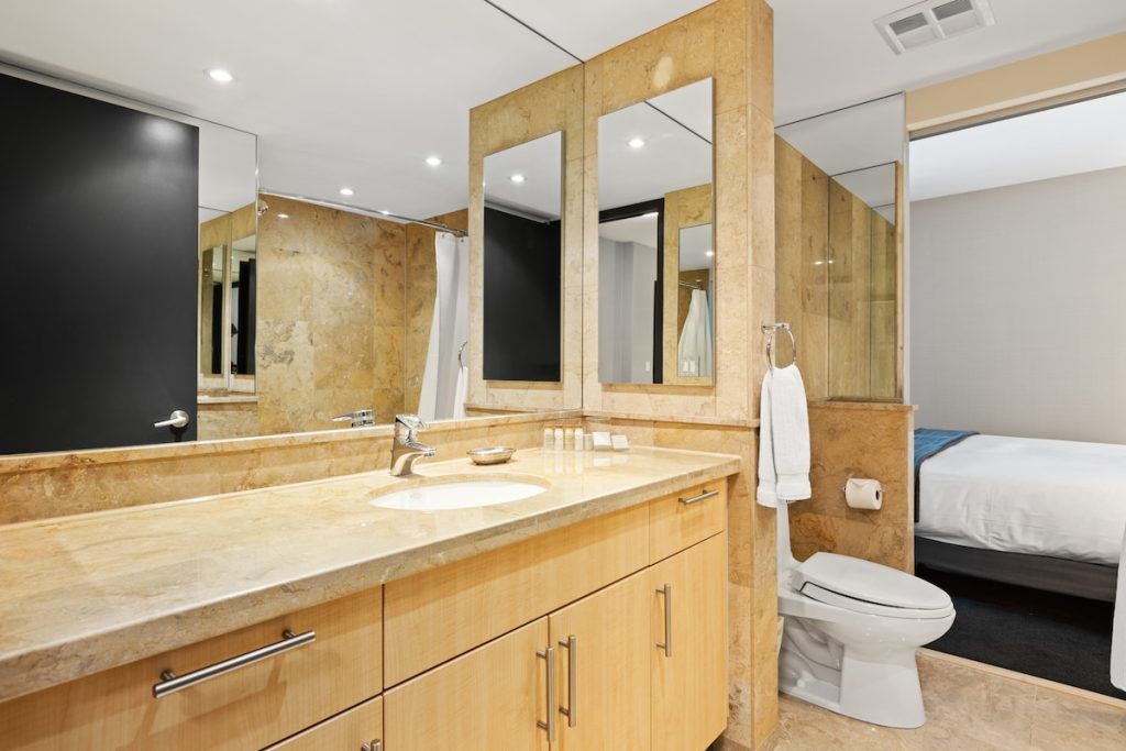 white ceramic sink near mirror