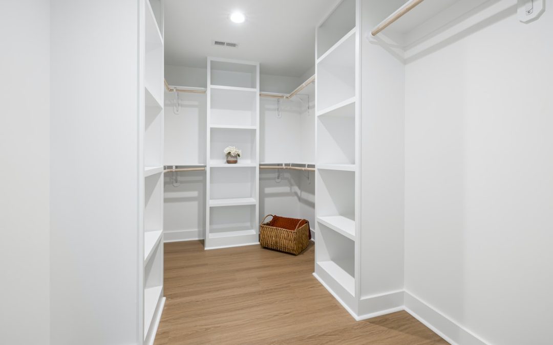 A Room with White Cabinets and Shelves with Wooden Flooring