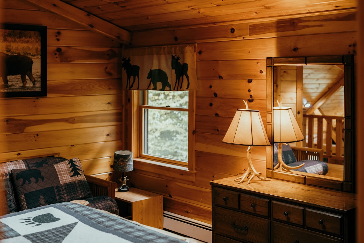 a bedroom with a bed and a mirror